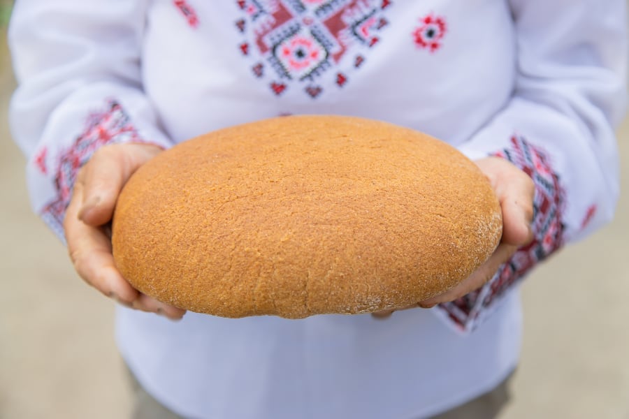 Photo of Ukrainian bread in woman's hands